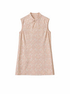 Front view flat lay of the dress showing the Mandarin collar, a single traditional button, and the intricate light pink and blue jacquard pattern.