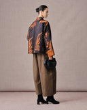 Back view of an antique bronze goldfish jacquard silk-blend jacket with contrasting cuffs