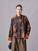 Front view of the antique bronze goldfish jacket with wide cuffs and traditional buttons
