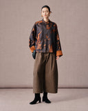 Full-length front view of an antique bronze goldfish silk-blend jacket with a Mandarin collar