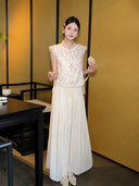Model wearing apricot cream pleated wide-leg pants with a layered lace hem, paired with a lace top and pearl shoes, showcasing the elegant drape of the 100% polyester fabric.