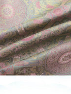 Draped Badayun Song brocade silk fabric showing its textured weave and soft pastel colors