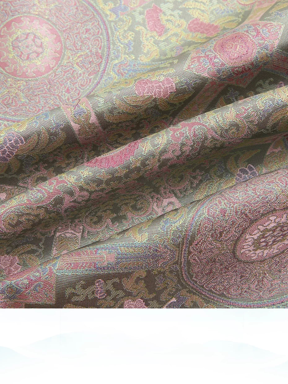 Draped Badayun Song brocade silk fabric showing its textured weave and soft pastel colors