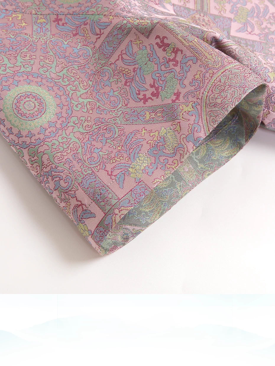 Close-up of Badayun Song brocade fabric with pastel geometric and floral motifs