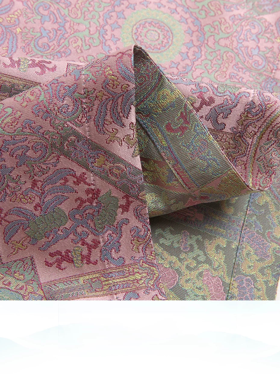 Detailed view of woven Song brocade fabric with repeating geometric medallions and floral motifs