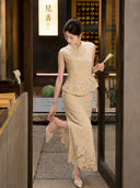 Side view of a beige sleeveless Cheongsam top with a lace peplum hem and matching skirt, holding a fan and lifting her foot.