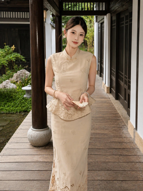 Model holding a folding fan, wearing a beige embroidered Cheongsam set with a mandarin collar and delicate lace details throughout.