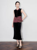 Model wearing a black velvet vest with burgundy floral jacquard panels, a rounded Mandarin collar and gold-tone buttons.