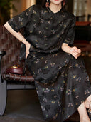 Chinese-inspired black butterfly silk top styled with a matching midi skirt