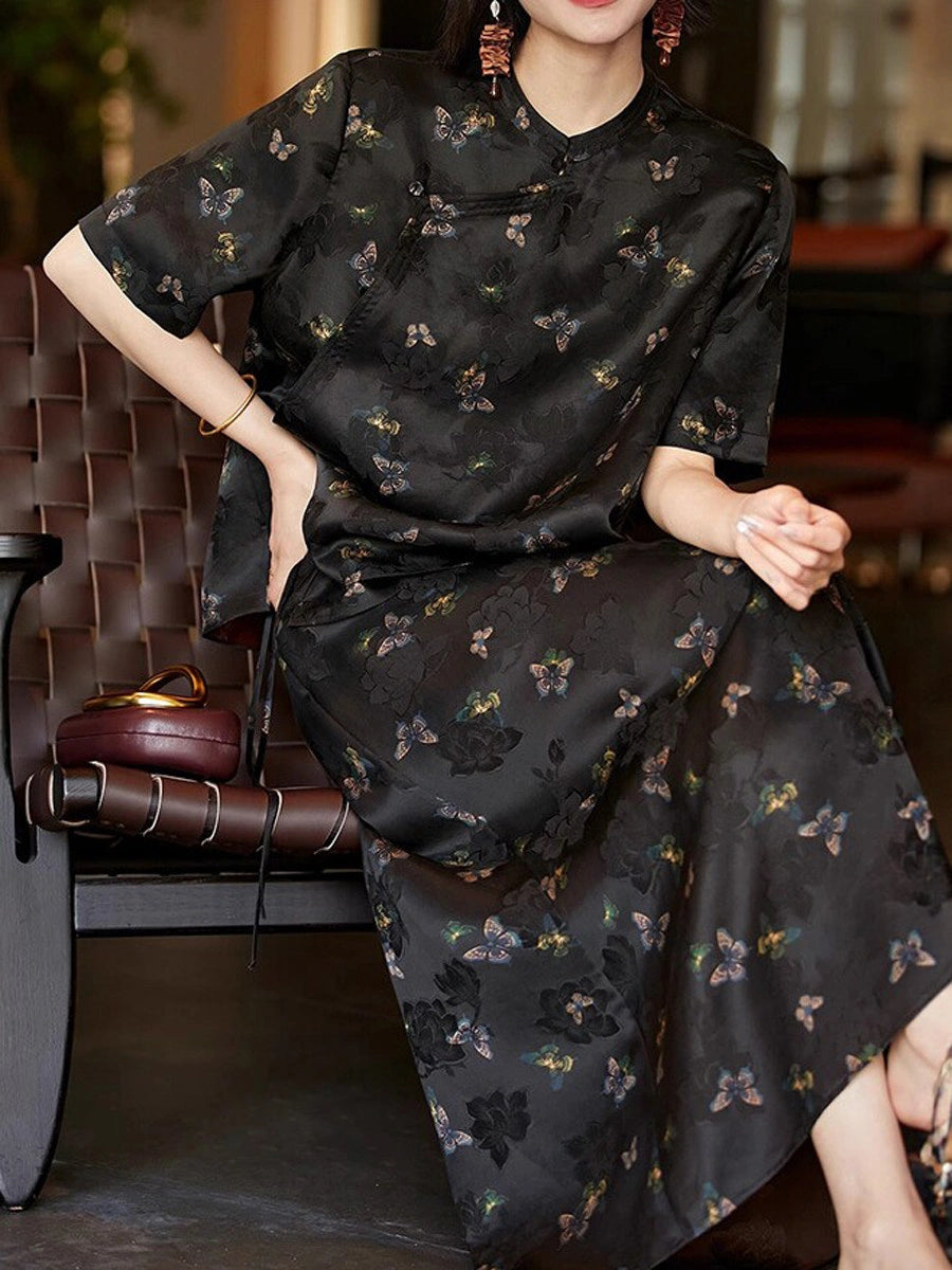 Chinese-inspired black butterfly silk top styled with a matching midi skirt