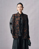 Front view of a black and copper floral jacquard vest with Mandarin collar and frog buttons