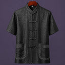 Black embroidered 100% mulberry silk men's Mandarin collar shirt with traditional frog button closure.