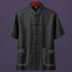 Black embroidered 100% mulberry silk men's Mandarin collar shirt with traditional frog button closure.