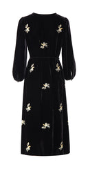 Back product view showing the dress’s scattered floral motifs