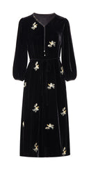 Front product view of the black embroidered dress and waist tie