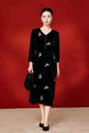 Full-length view of the black floral embroidered midi dress