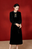 Model view highlighting the gold-stitched collar and cuffs