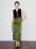 Model wearing a black silk-base velvet vest with green floral jacquard panels, Mandarin collar and gold-tone buttons.