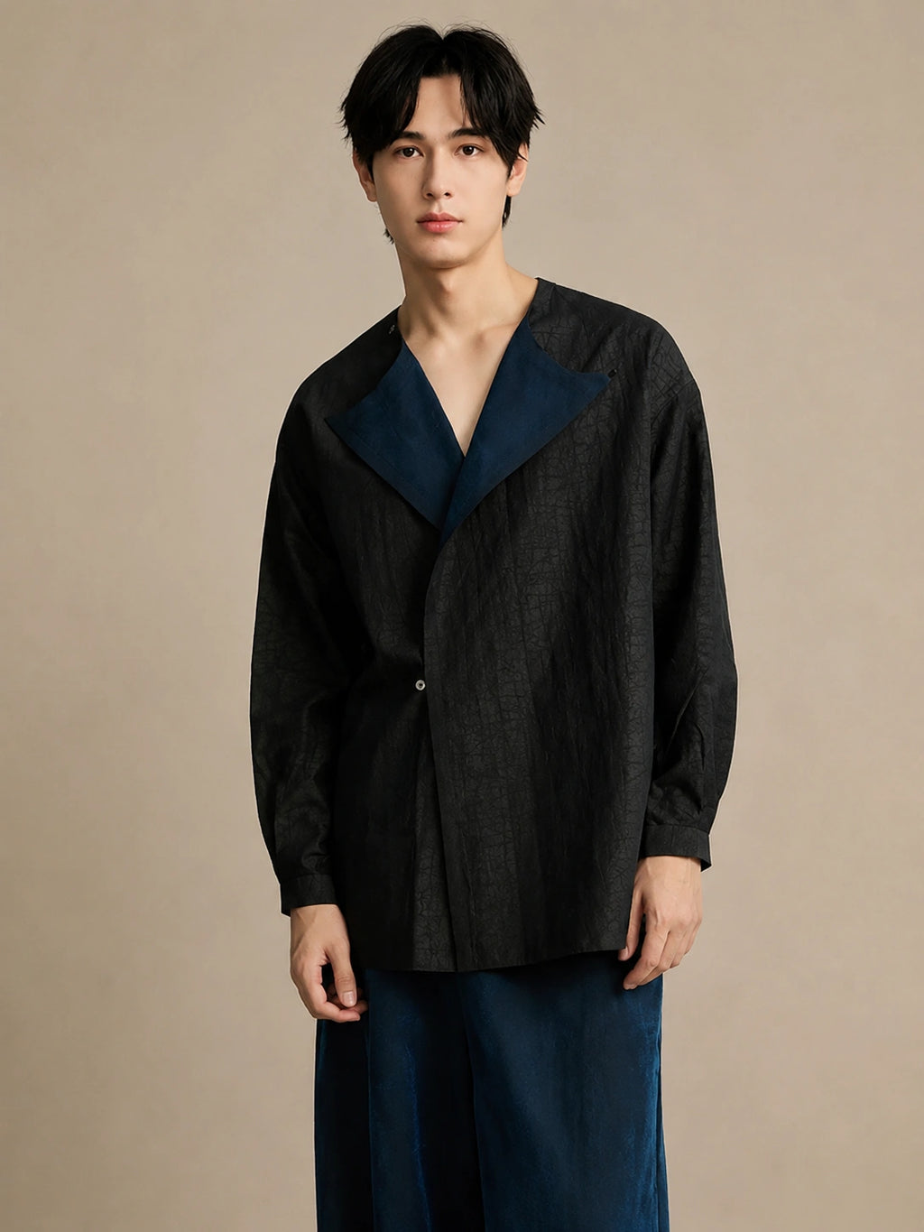 Black designer mulberry silk shirt with an open asymmetric collar and relaxed contemporary fit.
