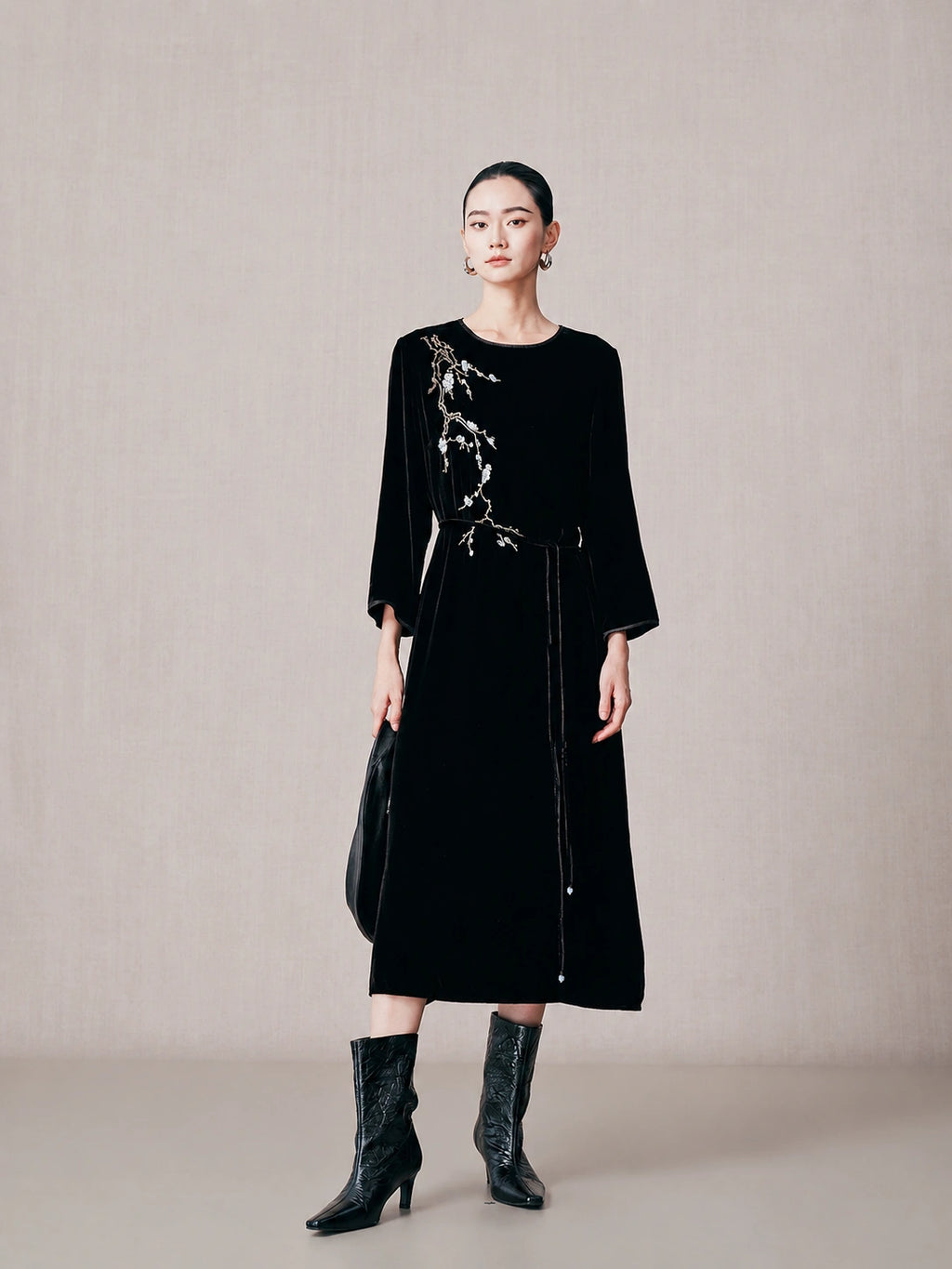Black 100% mulberry silk embroidered midi dress with long sleeves and removable waist belt.