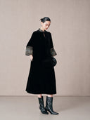 Side view of a black mulberry silk A-line dress with mandarin collar