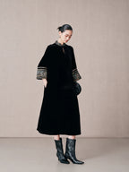Side view of a black mulberry silk A-line dress with mandarin collar