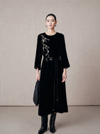 Elegant black mulberry silk embroidered dress with waist tie and minimalist styling.