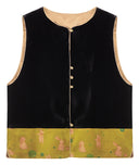 Front product view of the black velvet vest with pink rabbit motifs on a golden olive hem.