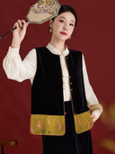 Model wearing the black velvet vest with a golden olive rabbit-patterned hem over an ivory blouse.