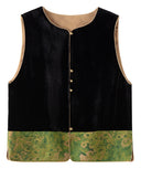 Front product view of the black velvet vest with a mottled green patterned hem and tan piping.