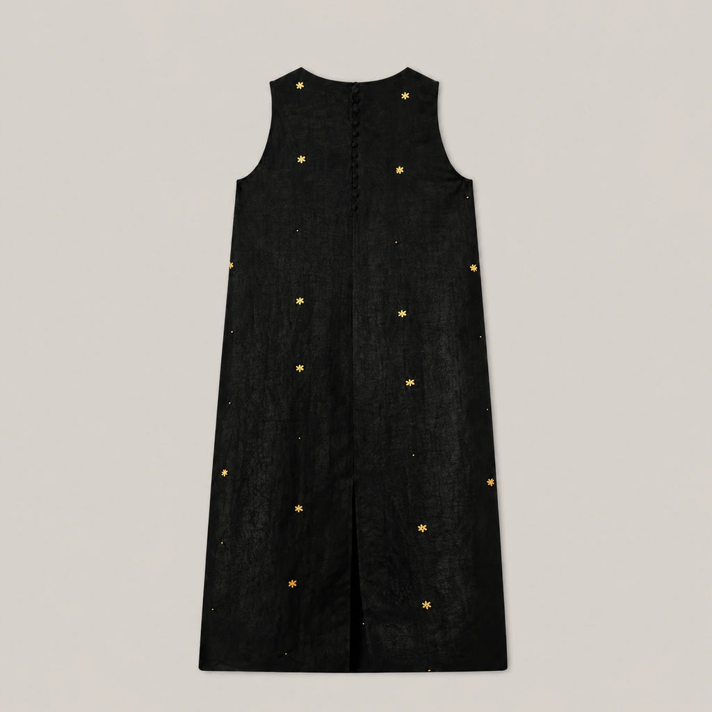 Back view of black Xiangyunsha mulberry silk dress showing button closure and embroidered details