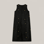 Back view of black Xiangyunsha mulberry silk dress showing button closure and embroidered details