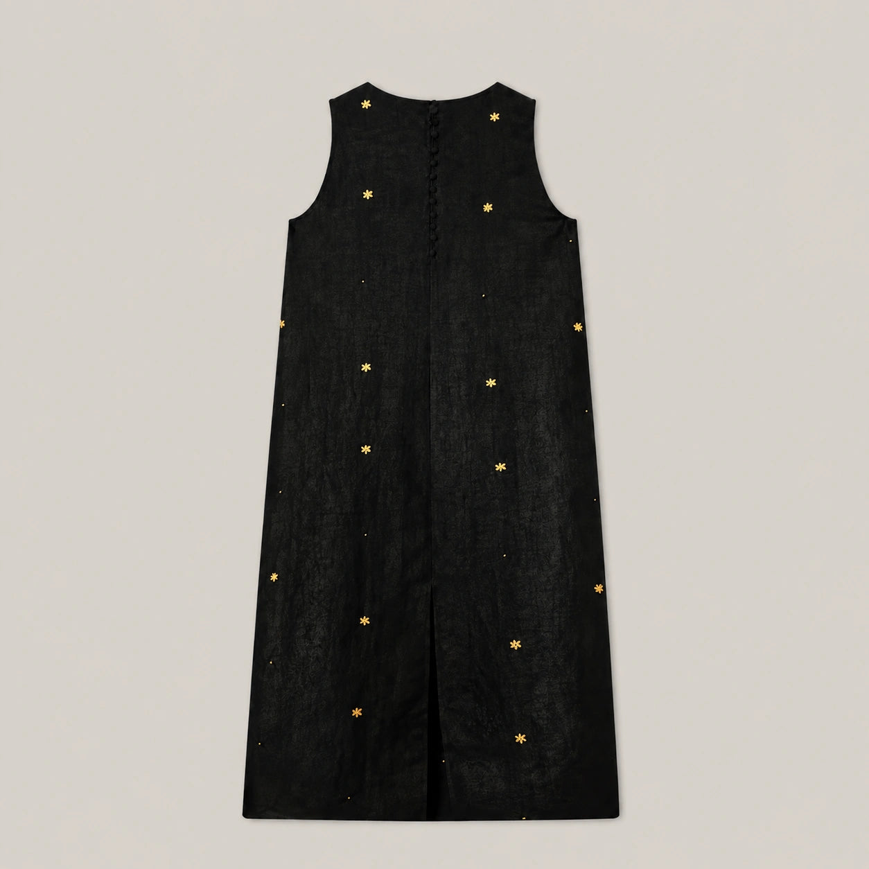 Back view of black Xiangyunsha mulberry silk dress showing button closure and embroidered details