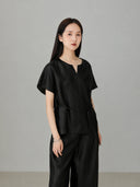 Black natural silk Xiangyunsha top styled in modern Chinese-inspired fashion with a relaxed silhouette and sophisticated summer look.