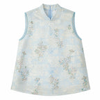Flat lay of a light blue sleeveless Cheongsam vest with a mandarin collar, beaded edges, and intricate floral sequin embroidery, crafted from 100% polyester.