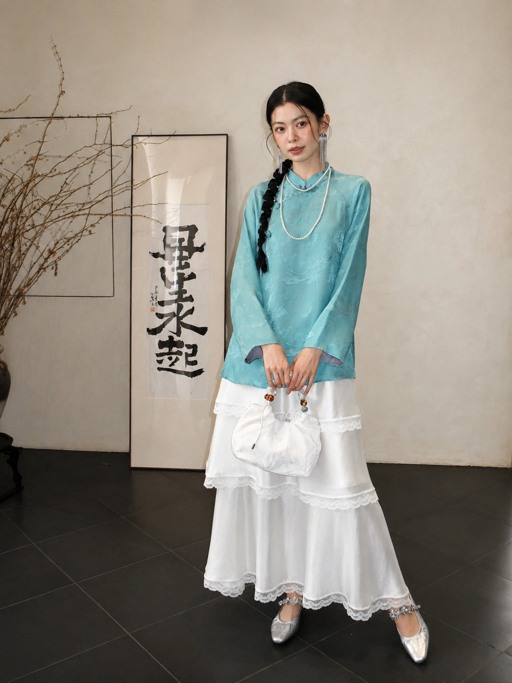 Front view of the blue Hualuo silk Chinese-style shirt with subtle bird and flower patterns