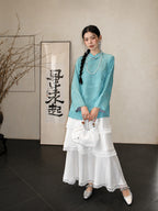 Front view of the blue Hualuo silk Chinese-style shirt with subtle bird and flower patterns
