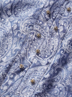 Detailed close-up of the intricate blue paisley print on a 72.8% cotton, 27.2% mulberry silk blend fabric, showcasing the texture and subtle sheen.