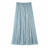 Flat lay of a blue pleated maxi skirt with an elastic waistband and full length, crafted from 80% Lyocell, 20% Polyester.