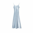 Flat lay of a light blue satin slip dress with a sleek silhouette and delicate shoulder straps, 100% polyester fabric.