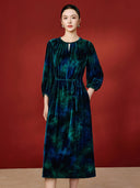 Front view of the blue tie-dye-inspired midi dress with a self-tie waist