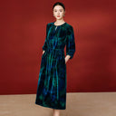 Full-length view of the blue and teal midi dress on a model