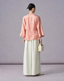 Back view of the blush pink jacquard Chinese blouse with wide three-quarter sleeves