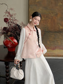 Front view of a blush pink Chinese-style silk vest with a turn-down collar, traditional knot closure, and butterfly pattern.