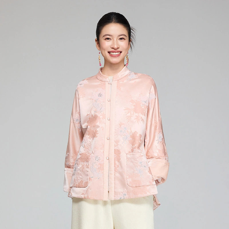 Front view of a blush pink wool and mulberry silk jacquard padded jacket with stand collar and patch pockets