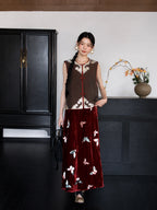 Full-body view of a brown 100% mulberry silk Chinese vest styled with a burgundy embroidered skirt.