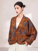 Front view of the relaxed floral silk jacket styled with a white top and trousers