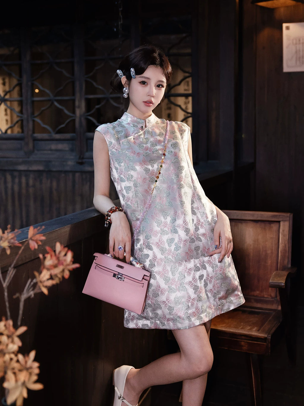 Model wearing a butterfly print new Chinese dress with a stand collar and relaxed H-line silhouette