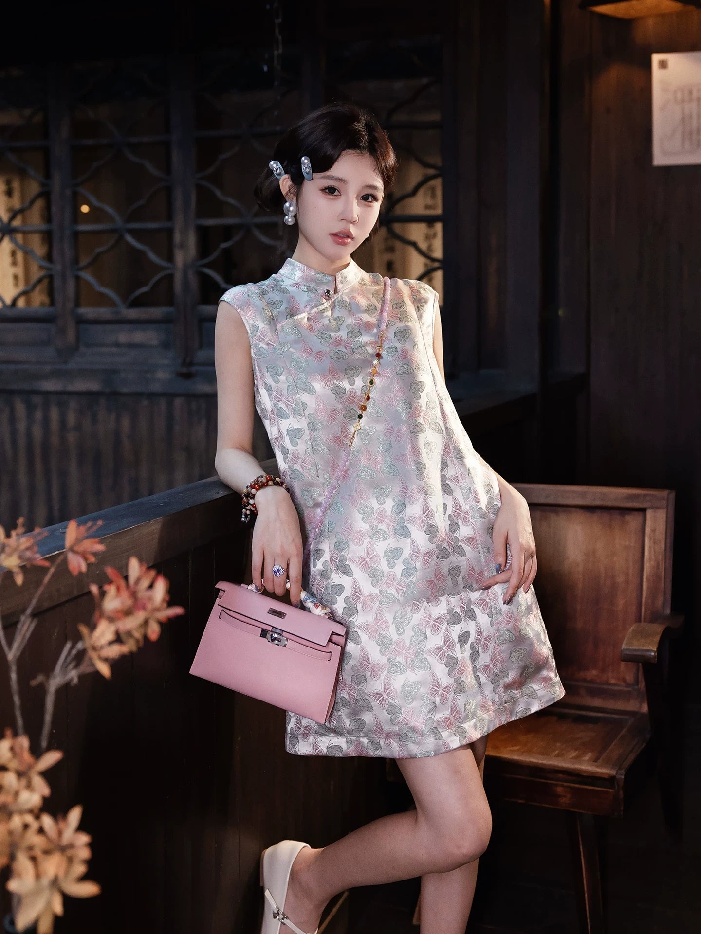 Model wearing a butterfly print new Chinese dress with a stand collar and relaxed H-line silhouette