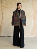 Full-length outfit featuring the Cangmo patterned jacket over a black top and wide-leg trousers.